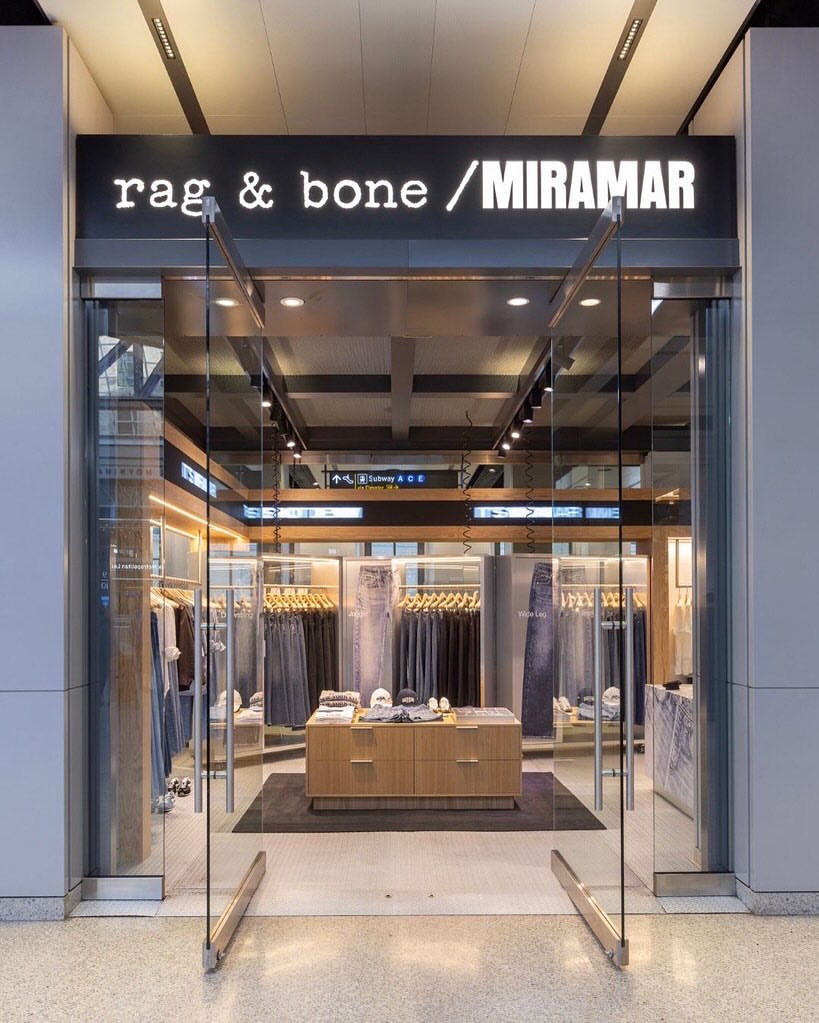 Storefront showing rag & bone using MIRAMAR name above its store entrance, photographed from the mall interior